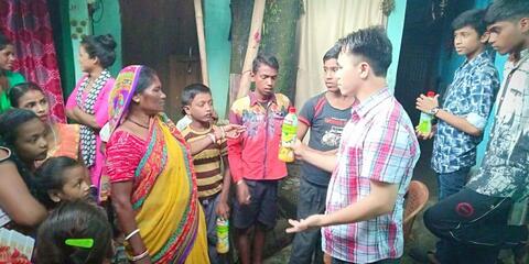 Distribution Juice Bottles to Slum peoples